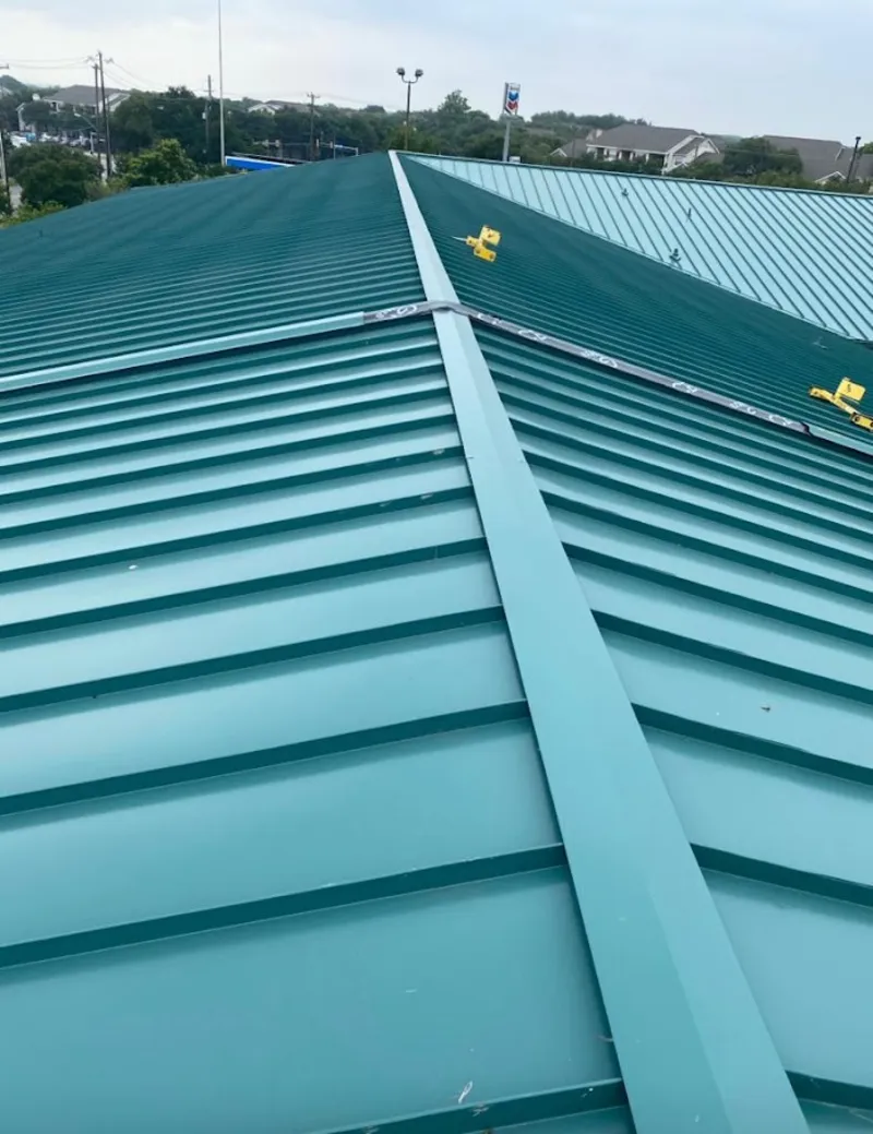 Green commercial metal roof ridge and valley for Metal Roof Repair in Yankee Springs